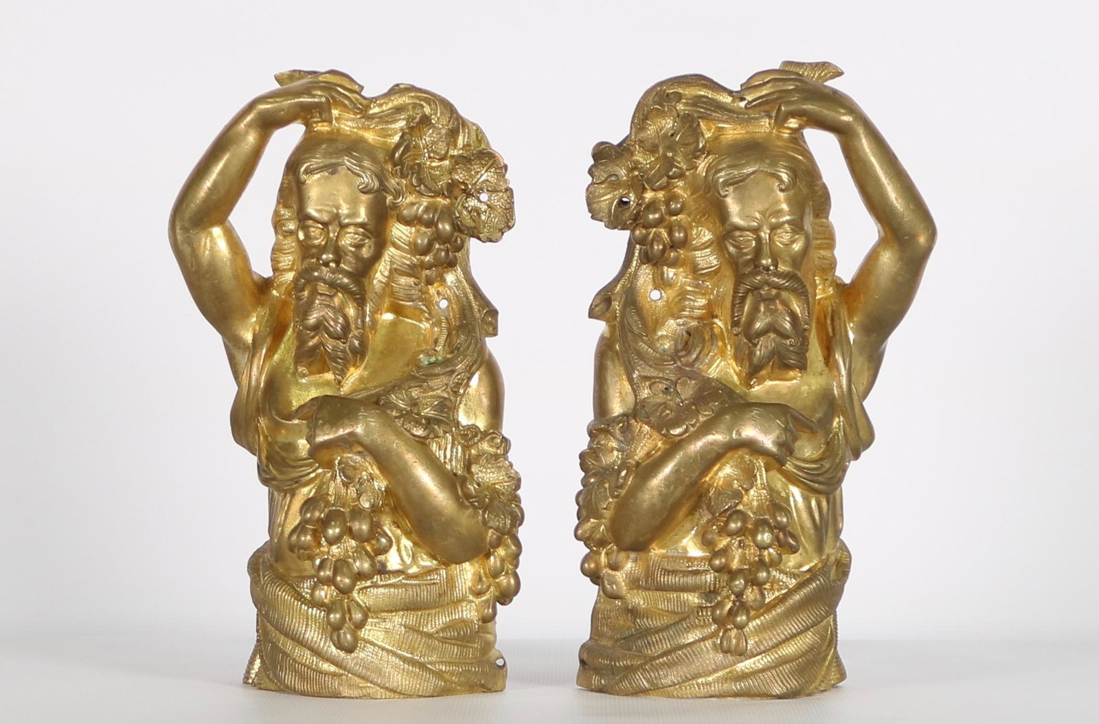 Mirror Pair 19 C Ormolu Baccus Capitals: Mirror Pair 19 Century Gilt Bronze or Ormolu "Baccus" Capitals. Height 8 inches (20.32 cm.) X width 5 inches (12.7 cm.). X depth 3 1/2 inches (8.89 cm.). NOTE: Any condition statement is given as a co