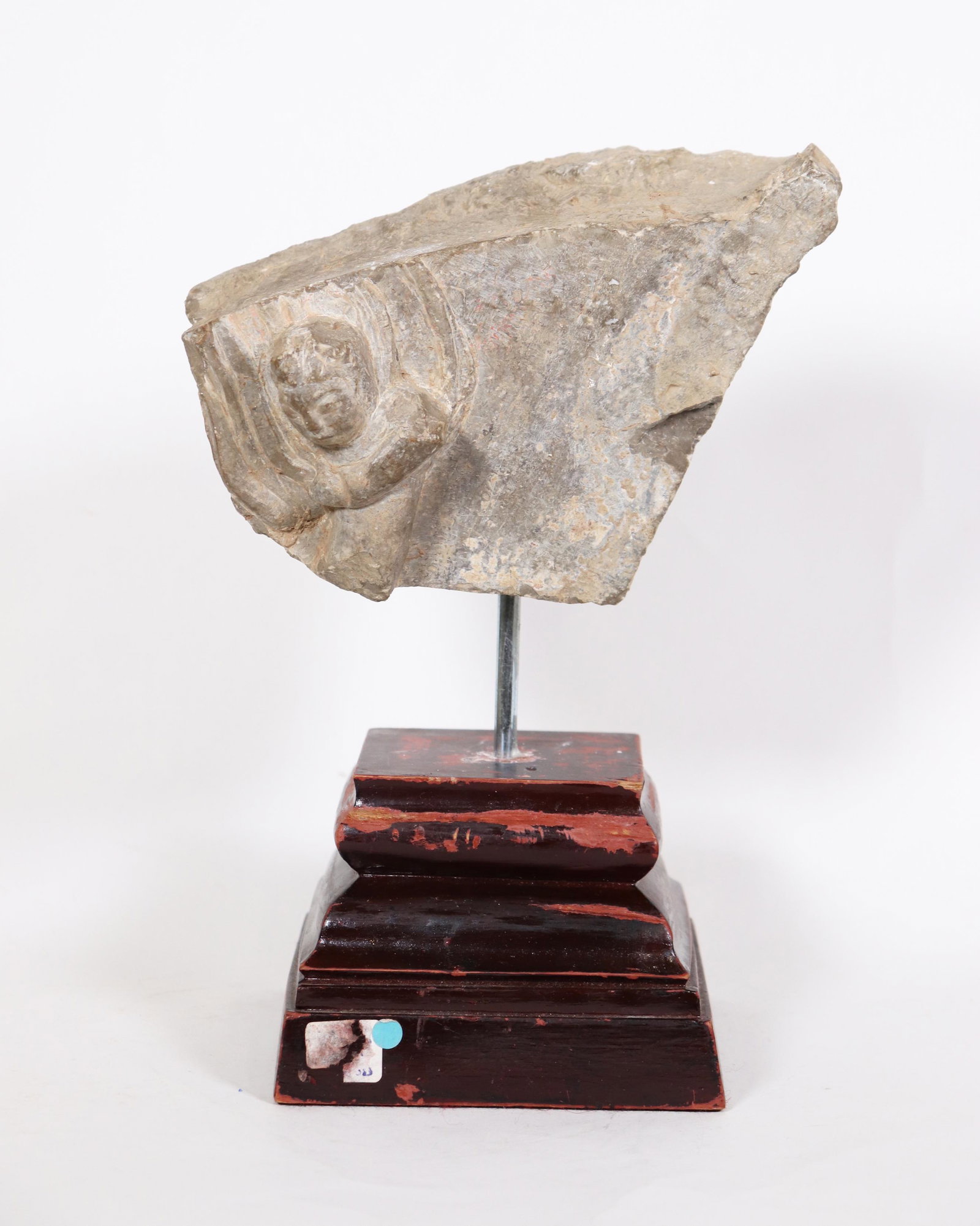 Chinese Carved Stone Apsara Fragment Possibly Tang: Chinese Carved Stone Flying Apsara Fragment, possibly Tang or Earlier. Drilled to the base and mounted on a wood exhibition stand. Height of stone 4 1/2 inches (11.5 cm.) X width 6 1/2 inches (16.5 cm