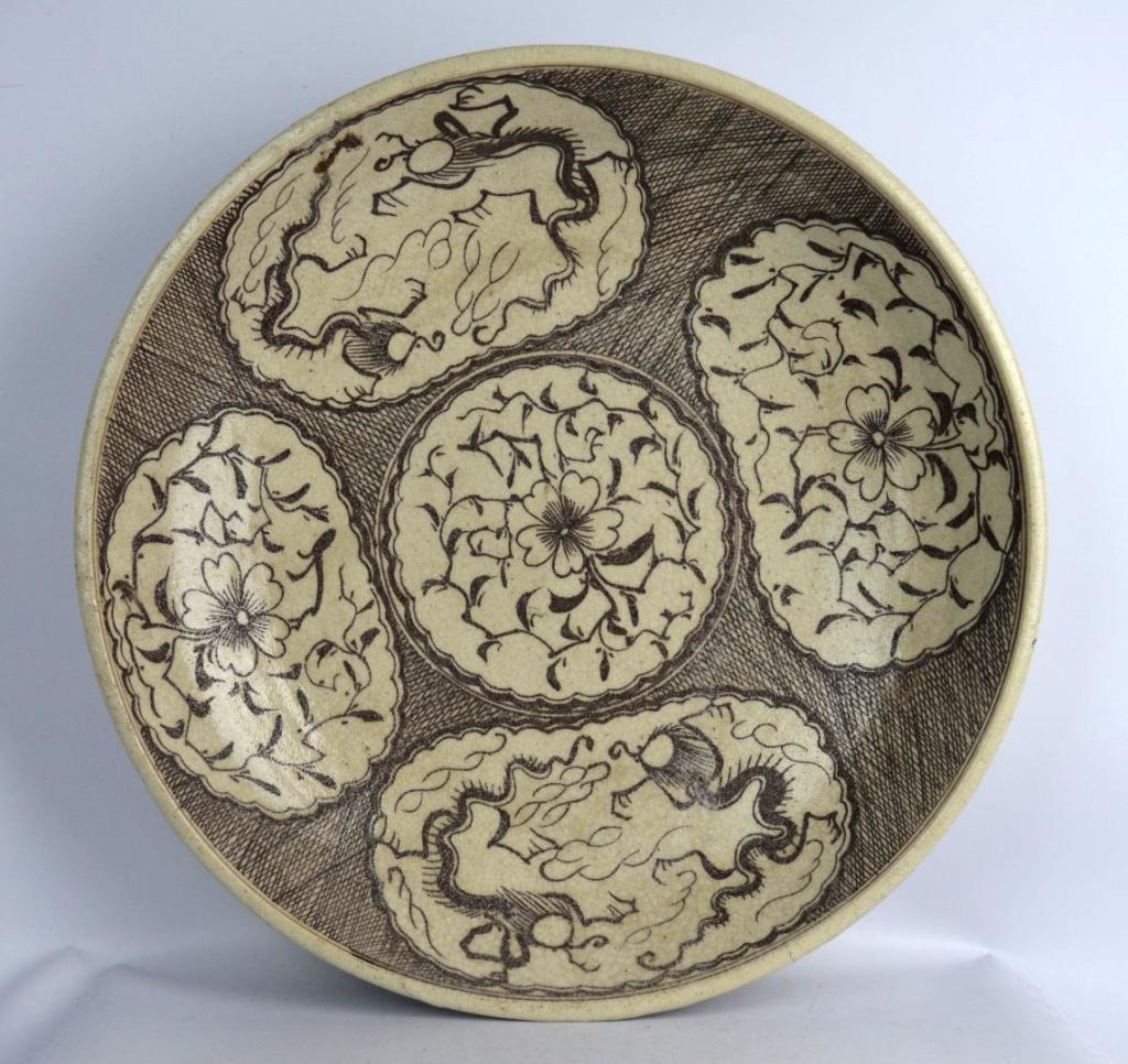 Rare Large Korean Charger with Dragons & Flowers: Rare Large Korean Charger with Dragons & Flowers drawn in brown slip over an oatmeal colored pottery; wide foot rim. Diameter 15 3/4 inches (40 cm.).Provenance: a Huntington Long Island Collection.