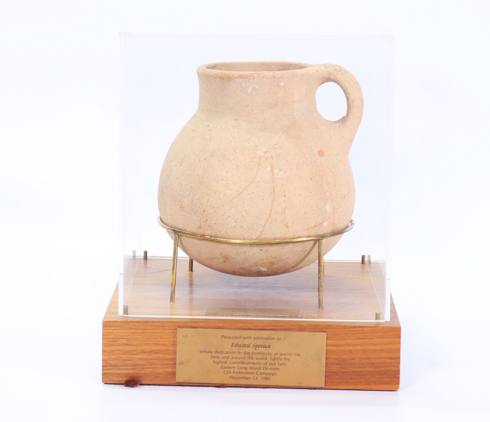 Persian Period Israeli Antique UJA Award 1985: Persian Period (586 BCE - 330 BCE) Antique Pottery single handle round mouth Pitcher mounted in a display case with notation, "Unearthed from the soil of Israel" and "Presented with admiration to Edwa