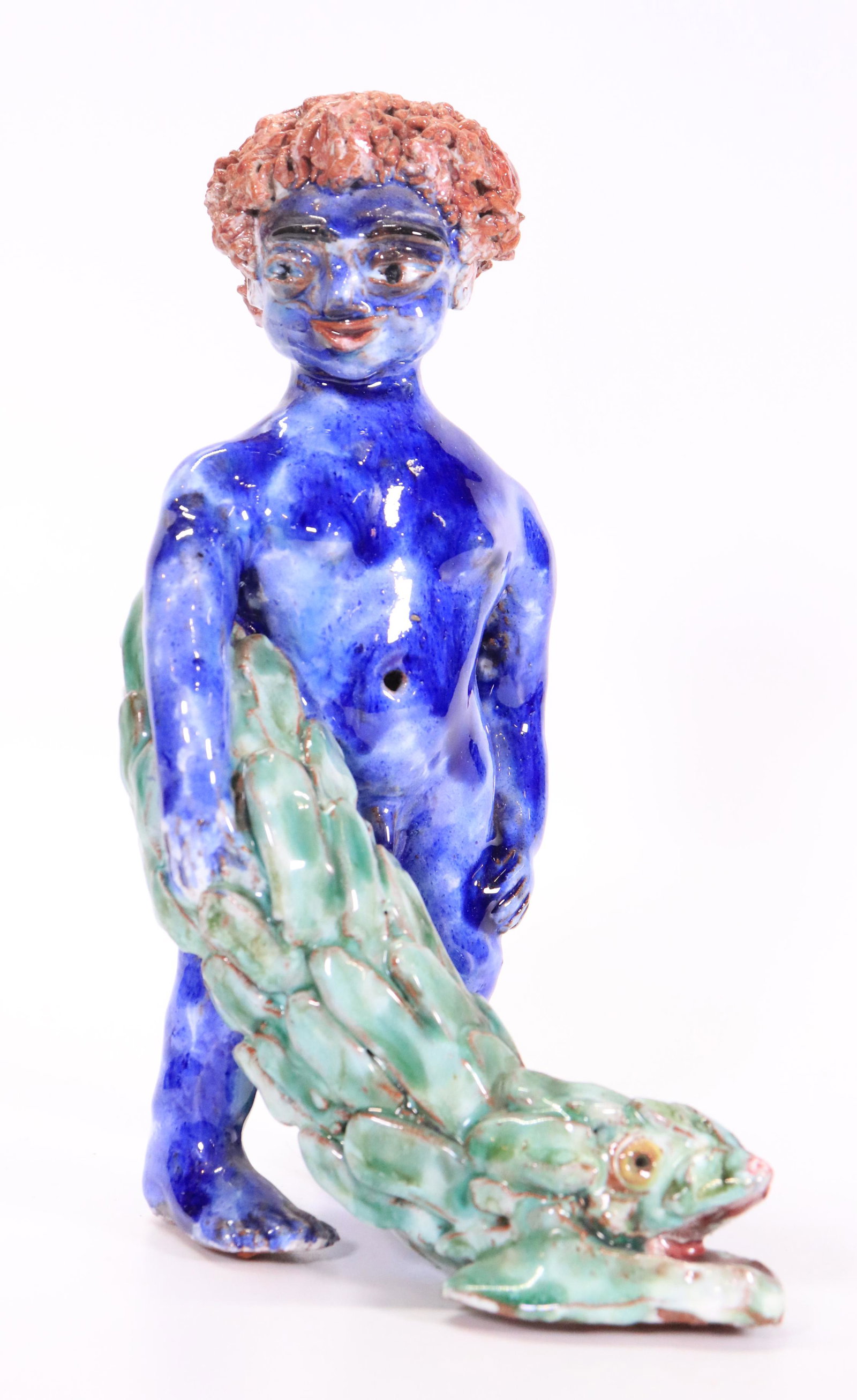 Wiener Werkstatte Style Terra Cotta Boy & Fish: Wiener Werkstatte Style Glazed Terra Cotta Nude Blue Boy & Green Fish; unmarked. Height 8 1/4 inches (21 cm.).