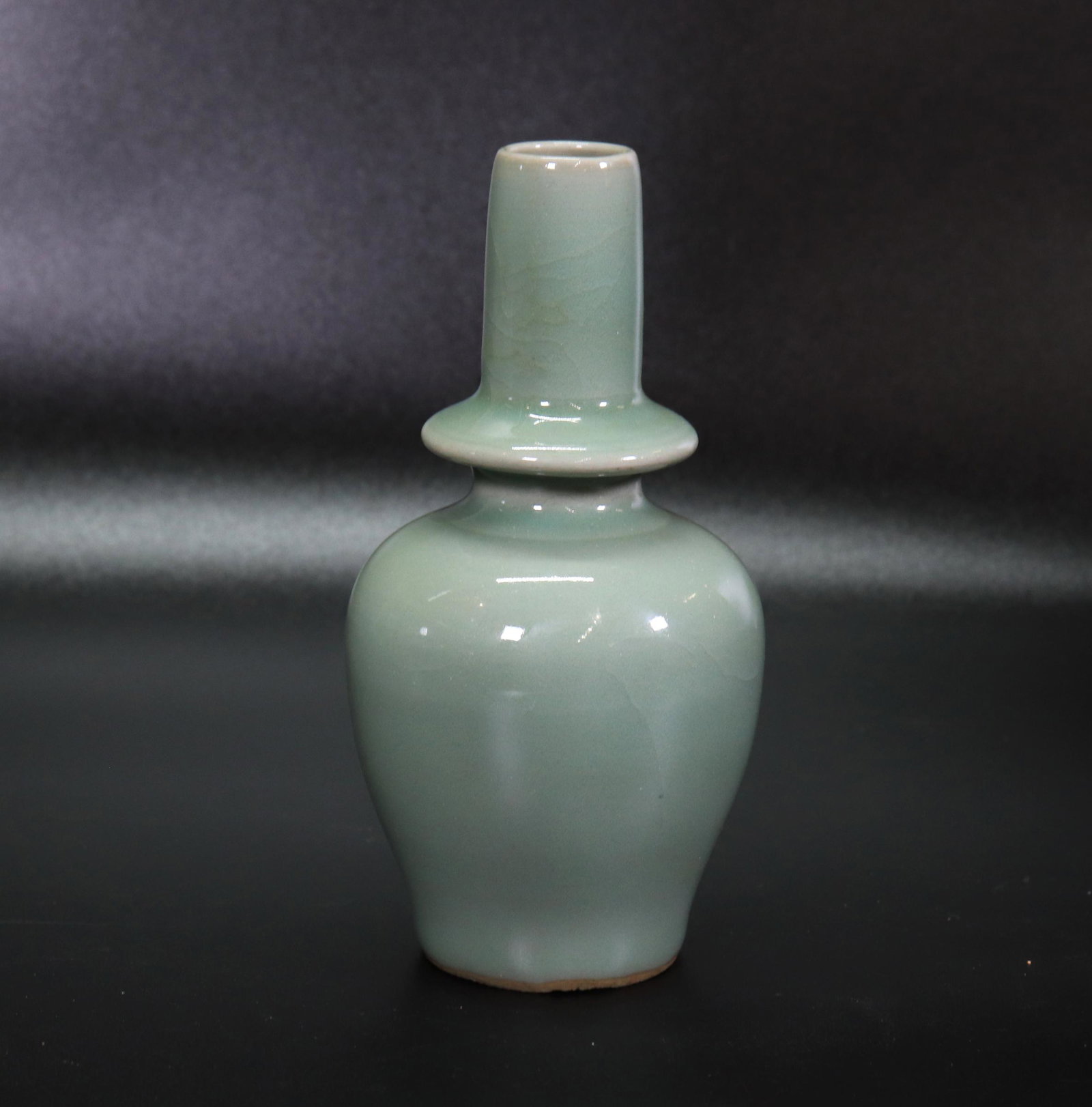 Chinese Celadon Porcelain Buddhist Ritual Urn: Chinese Celadon Porcelain Buddhist Ritual Urn. Height 5 3/4 inches (14.5 cm.).