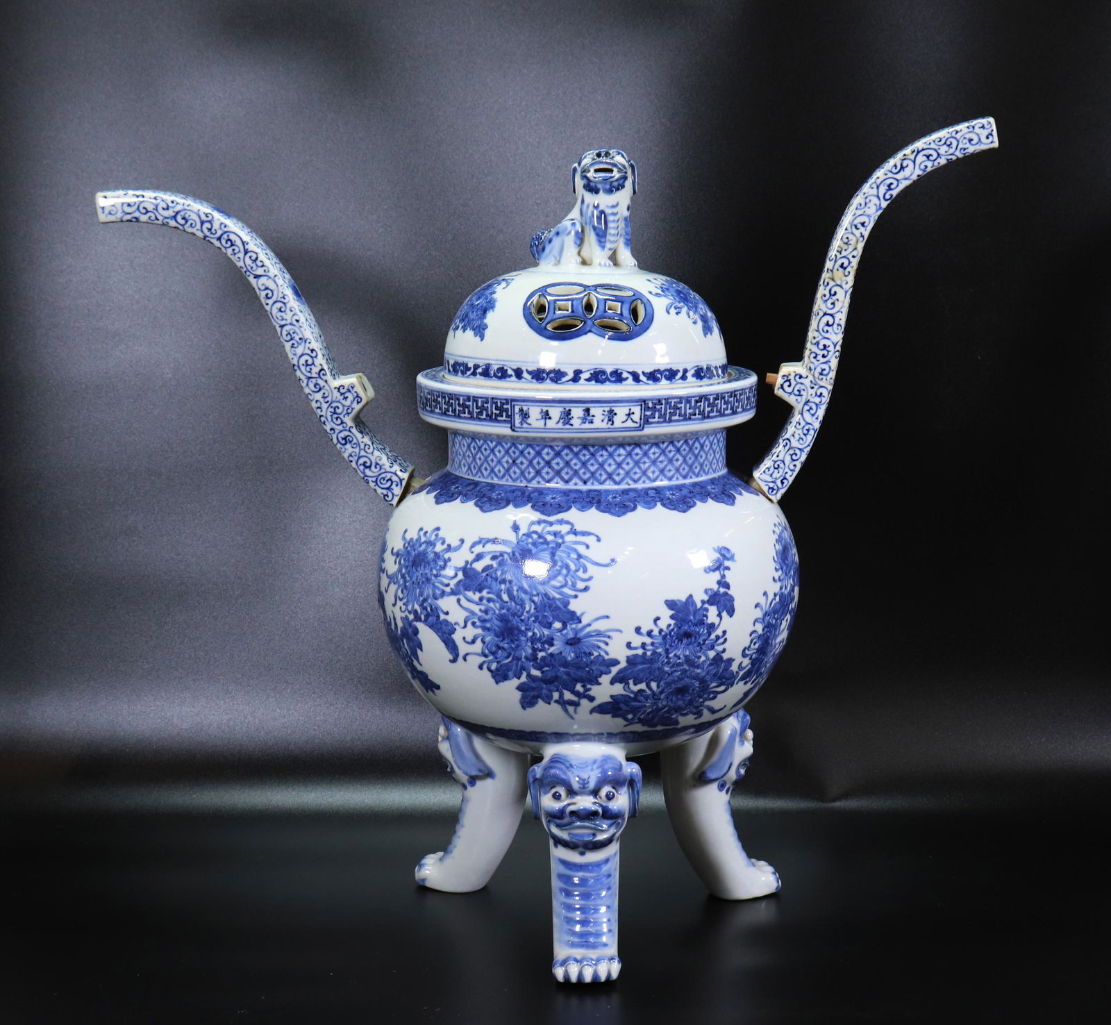 Large Chinese Blue White Porcelain Incense Burner: Large Chinese Blue & White Porcelain Incense Burner with a design of Chrysanthemums on 3 Tiger Legs with "Wang" mark to forehead, the rim with a 6 character Da Ming Jia Jing Nian Zhi horizontal mark,