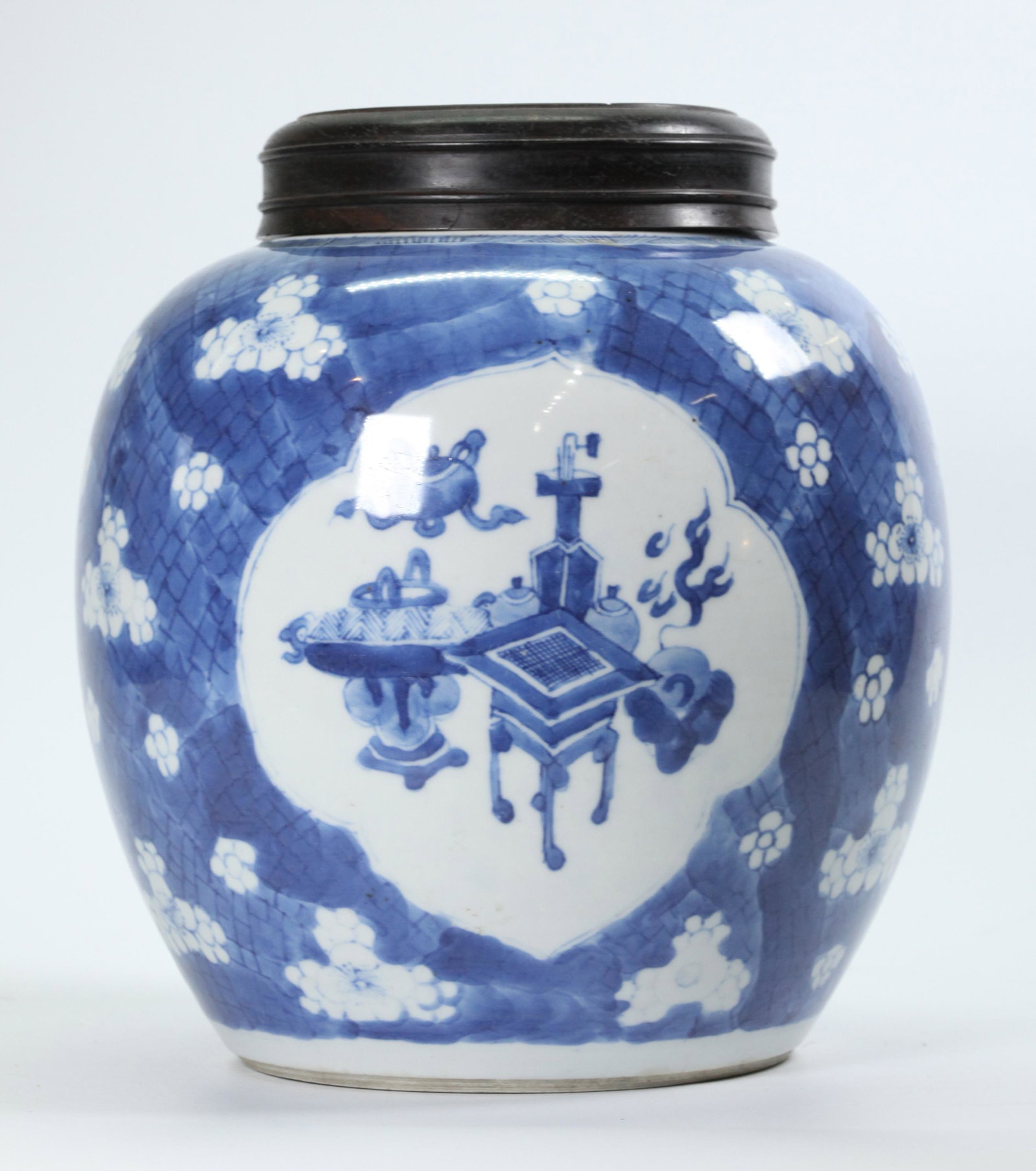 Chinese Qing Dynasty Blue & White Porcelain Jar: Chinese Qing Dynasty Blue & White Porcelain Jar with 3 windows of Auspicious Objects on a ground of White flowers on a blue cracked ice ground, now with a hard wood cover with pierce-work Dragon to ce