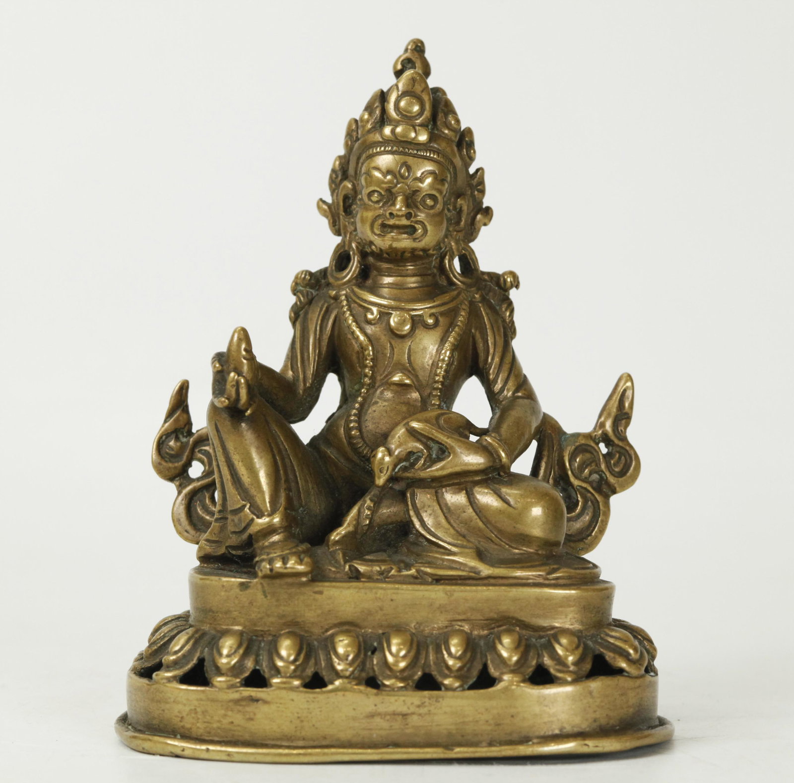 Tibetan 19th C Bronze of Seated Jambhala: Tibetan 19th Century Bronze of Seated Jambhala & Mongoose on opened pierced Lotus throne, 2 holes to the back for a now missing mandala. Height 3 3/4 inches (9.5 cm.).