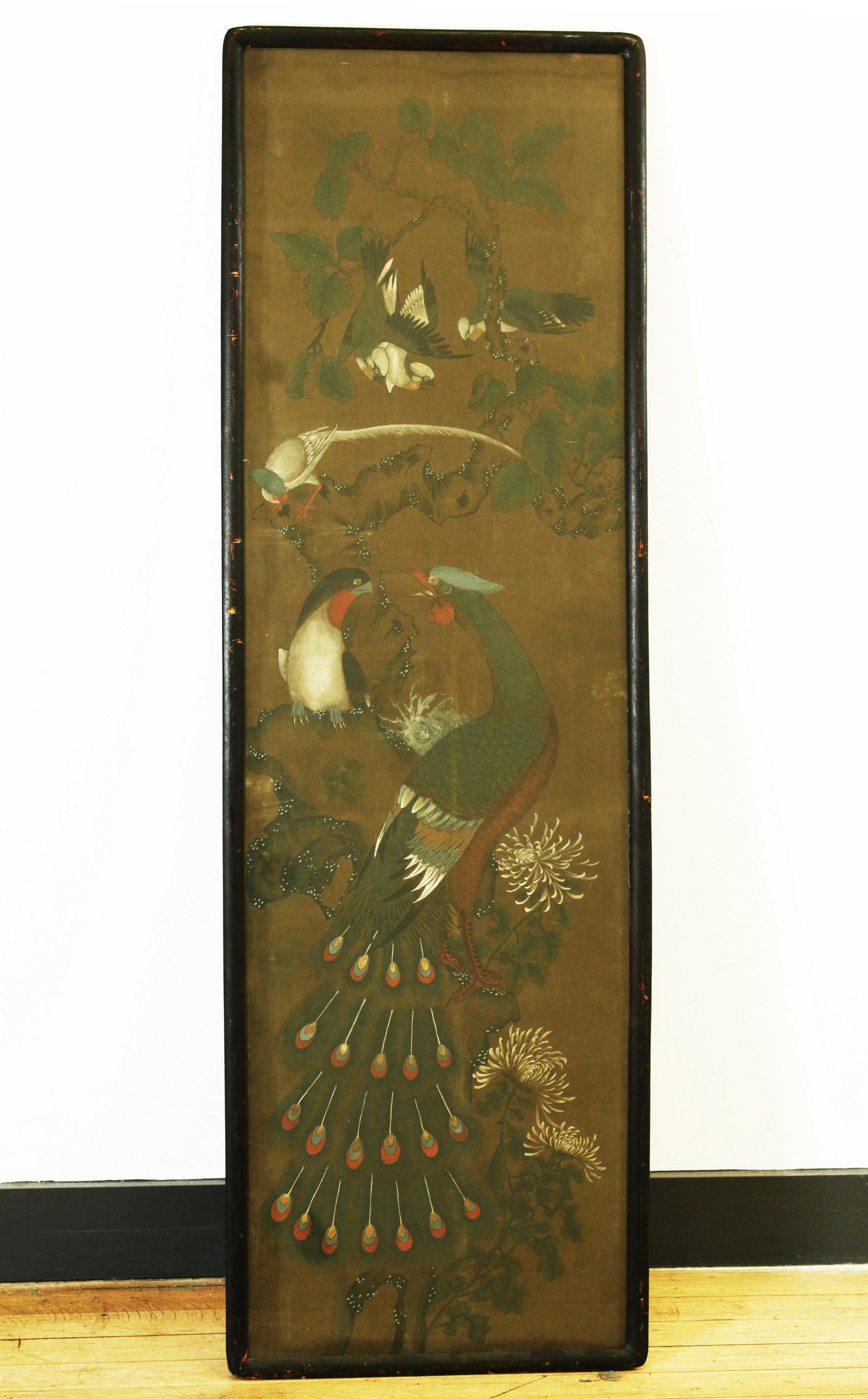 Chinese Peacock & Bird Painting on Silk: Chinese Peacock, Bird & Chrysanthemum Painting with white highlights on Silk; now mounted to the edges of the art in a frame with rounded corners, traces of old brocade folded to back. Height of frame
