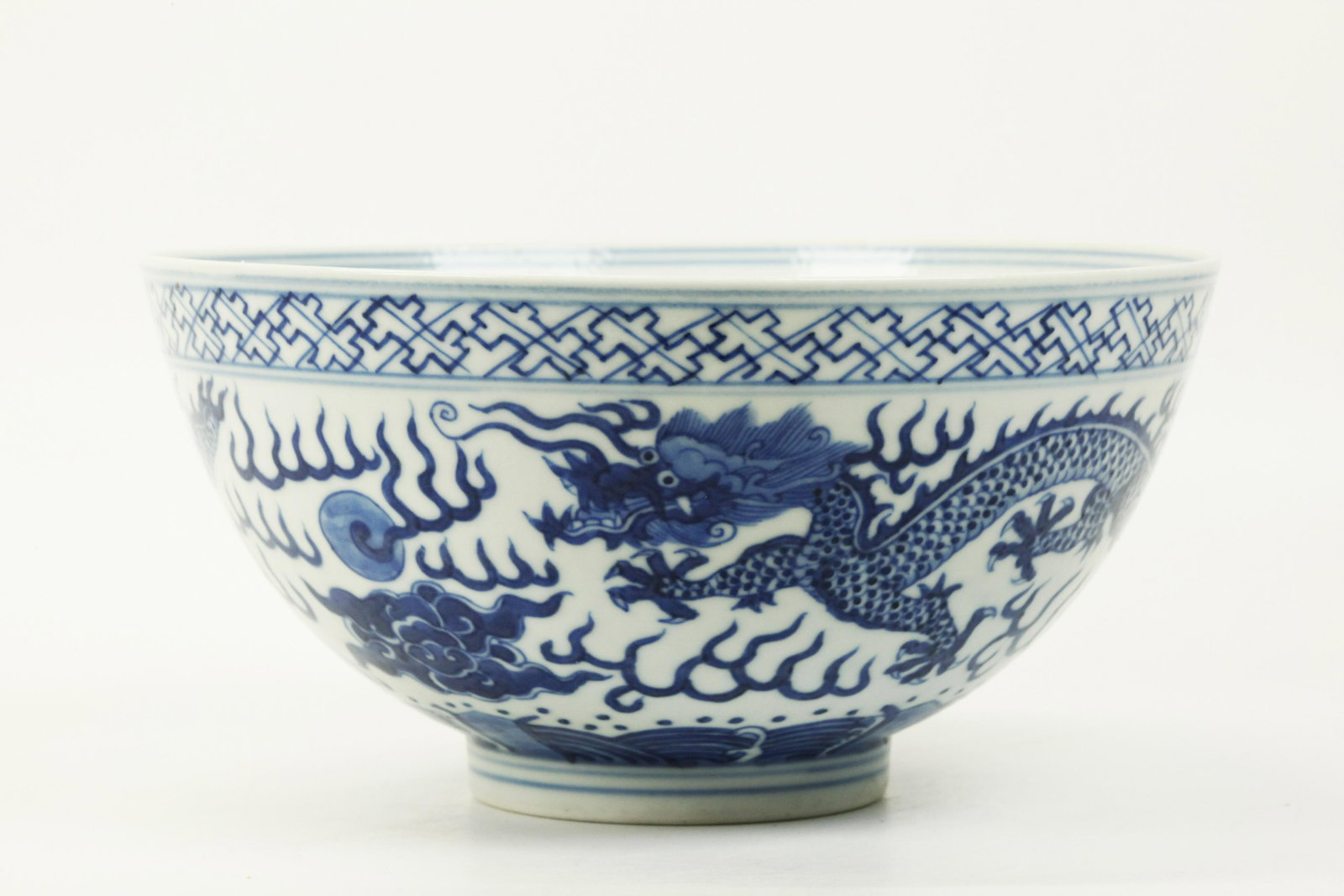 Chinese Blue & White Porcelain Double Dragon Bowl: Chinese Blue & White Porcelain bowl with Double Dragons & Flaming Pearls in clouds over waves, the inside with 5 Bats & Shou; the base with 6 character Guangxu mark in underglaze blue. Diameter 6 3/4