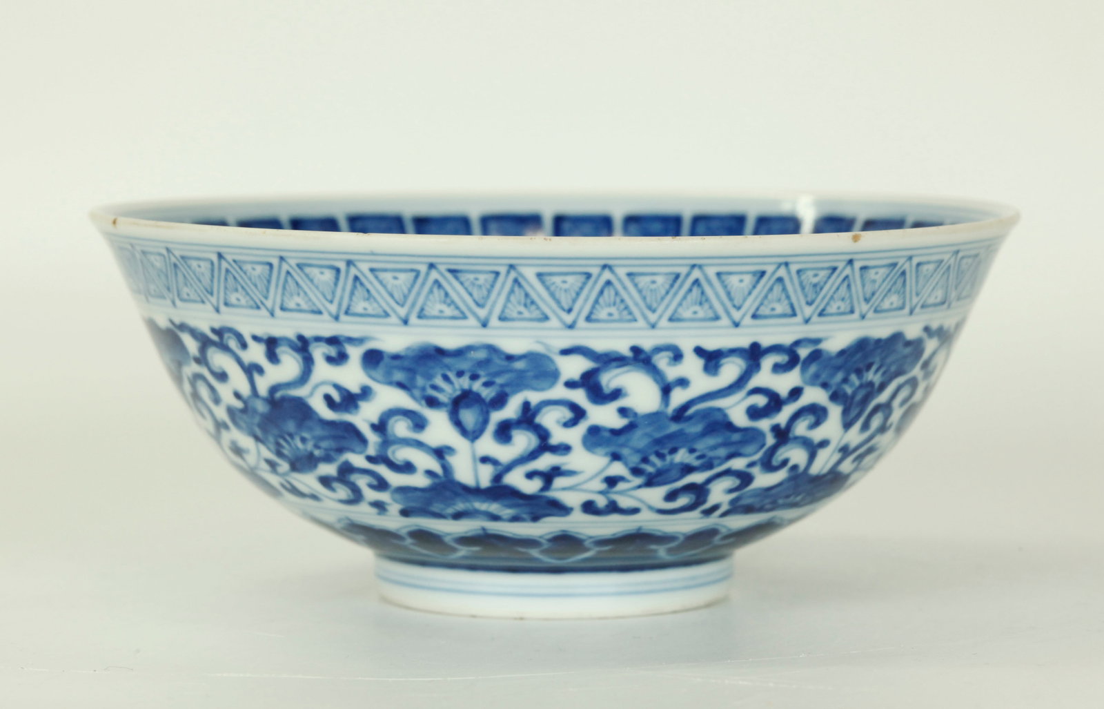 Chinese Blue & White Porcelain Bowl: Chinese Blue & White Porcelain Bowl, the inside and outside with various "embroidery" borders, the base with a 6 character Daoguang seal mark in underglaze blue. Diameter 6 inches (15.3 cm.).