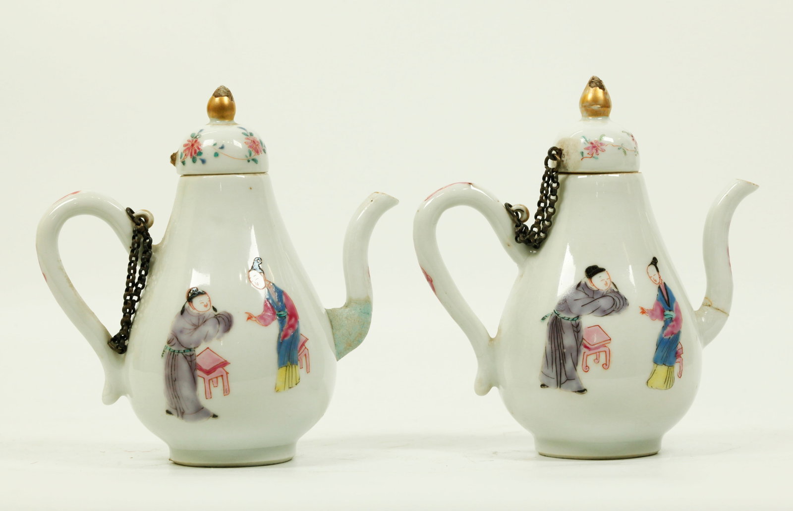 Rare Pr Chinese 18 C Enameled Porcelain Wine Pots: Rare Pair Chinese early 18th Century Famille Rose Enameled Porcelain Wine Pots with intimate scenes of Men & Women, the handles and covers with small rings with old chains. Height with cover 5 inches 