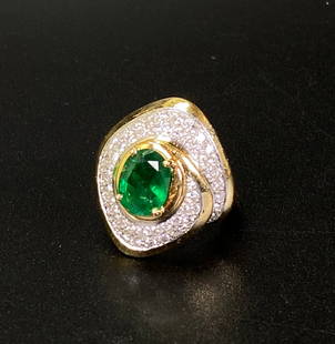 Oval Cut Emerald & Diamond 18K Gold Ring: Oval Cut Emerald & Pave Diamonds in an 18K Yellow Gold Ring. US Ring size 6. Total Weight 13 grams.