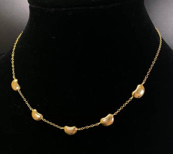 Tiffany; Elsa Peretti 5 Bean 18K Chain Necklace: Tiffany & Co; Elsa Peretti Necklace 5 Bean between Chains design all in yellow gold marked "Tiffany & Co / Elsa Petetti / 750." The closure with a tab marked "Tiffany & Co / Peretti." Total length 15
