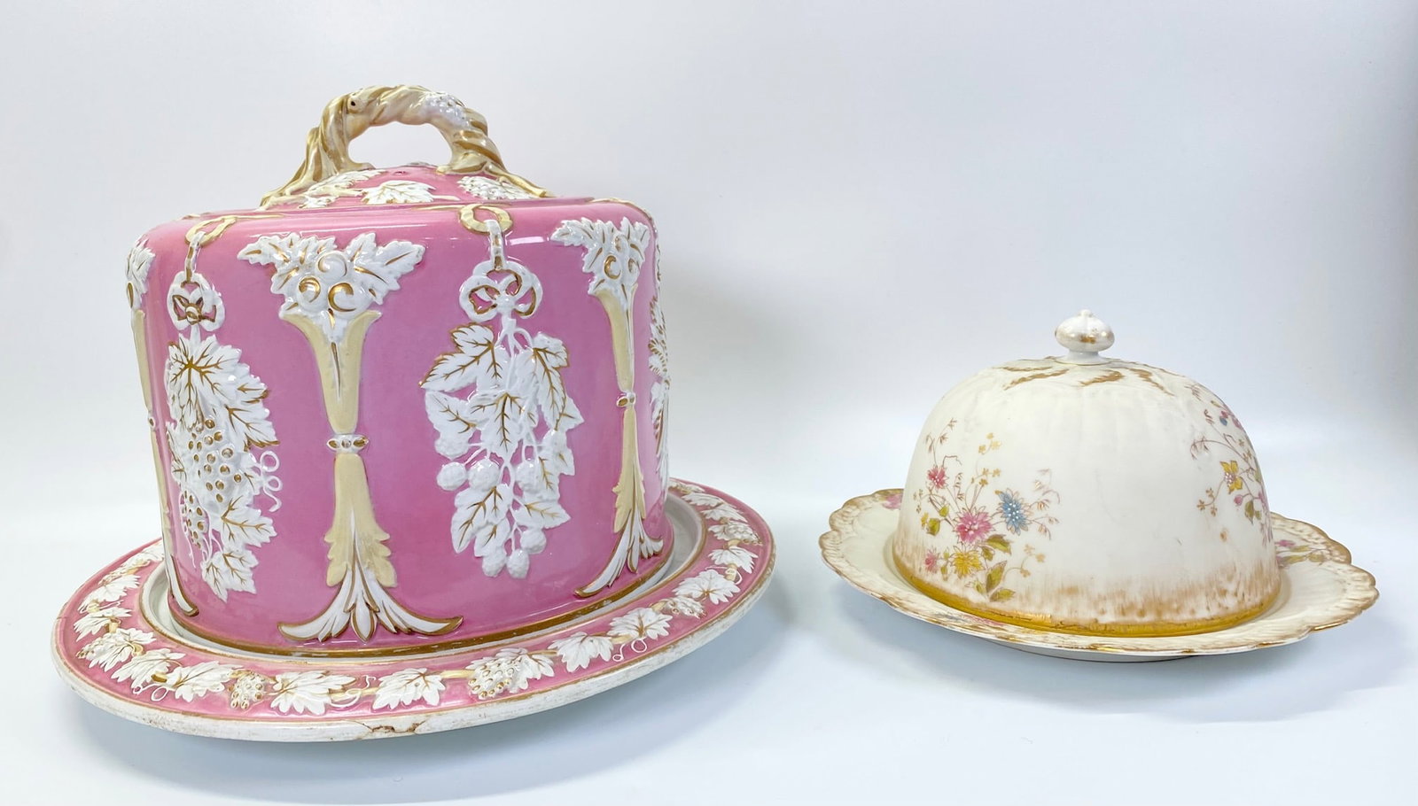 2 European 19th C Porcelain Cake/Cheese Domes: 2 European 19th Century Porcelain Cake or Cheese Domes each with matching under-plates: the larger in "Minton" Style with Grapes, Berries and Wheat designs molded to sides in clear glaze with gilding 