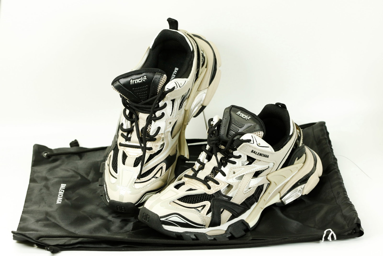 Balenciaga USA 14 Sneakers; Storage Bag: Balenciaga #44 (USA 14) Black/White/Cream/Gold Sneakers, "track2" to tongues, Black Storage Bag.