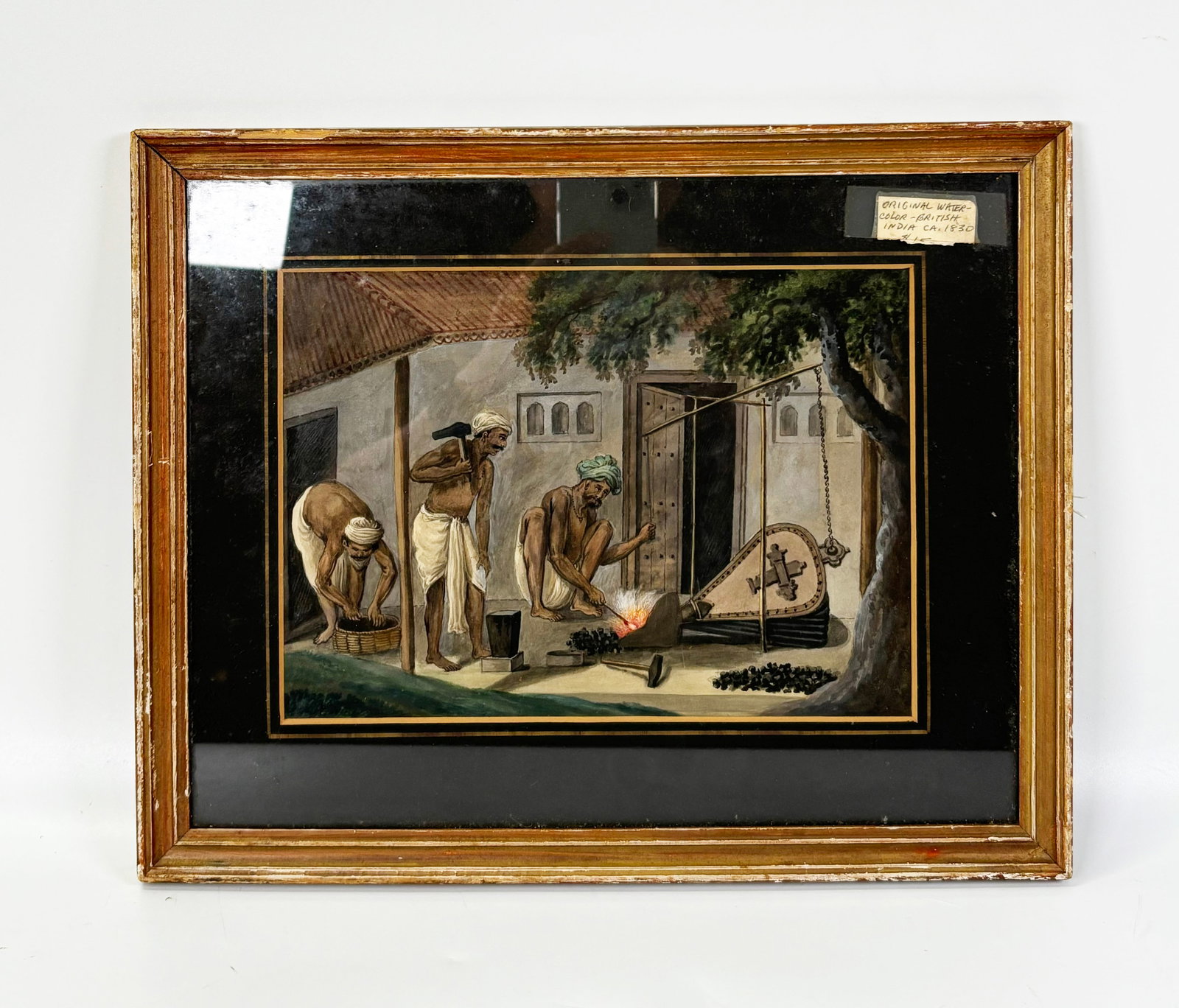 British India 1830 Watercolor Traveling Ironsmith: British Colonial India Genre Watercolor on Paper circa 1830; Native Indian Traveling Ironsmith with anvil, bellows and hand-operated pump-stand. Matted and framed. Visible height of art 6 3/4 inches (