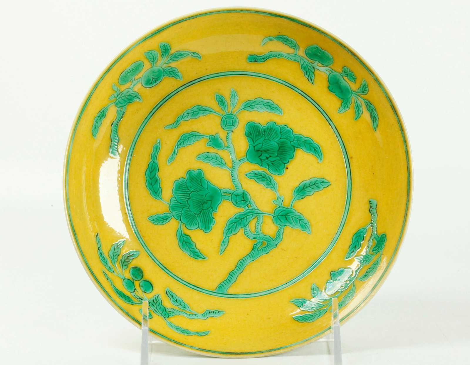 Chinese Yellow & Green Enameled Porcelain Plate: Chinese Yellow & Green Enameled Porcelain Plate over an incised design of Flowering stems to the center and fruit branches to the edge, the reverse with lotus; the recessed base in clear glaze with a 