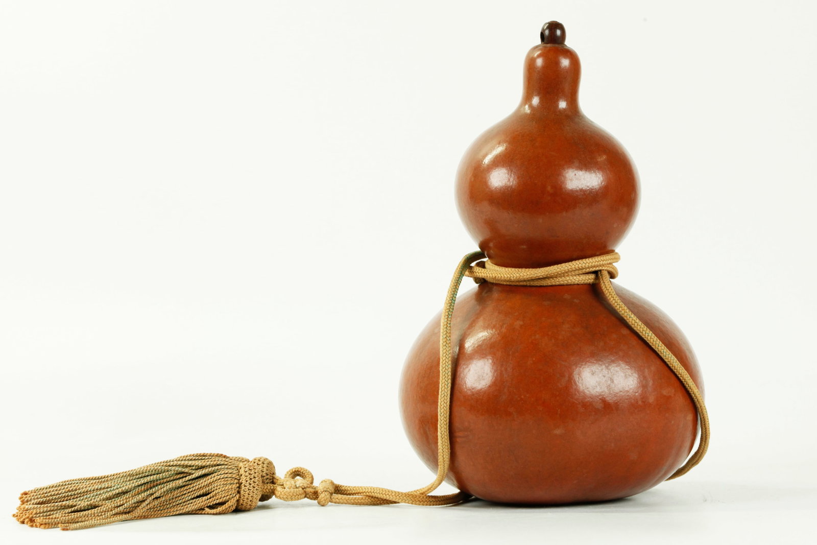 Chinese 19th C Double Gourd; Plug & Cord Tassel: Chinese 19th Century Double Gourd Calabash with wood Plug at top & good Cord & double Tassel wrapped around mid-section. Height 7 3/4 inches (19.5 cm.).