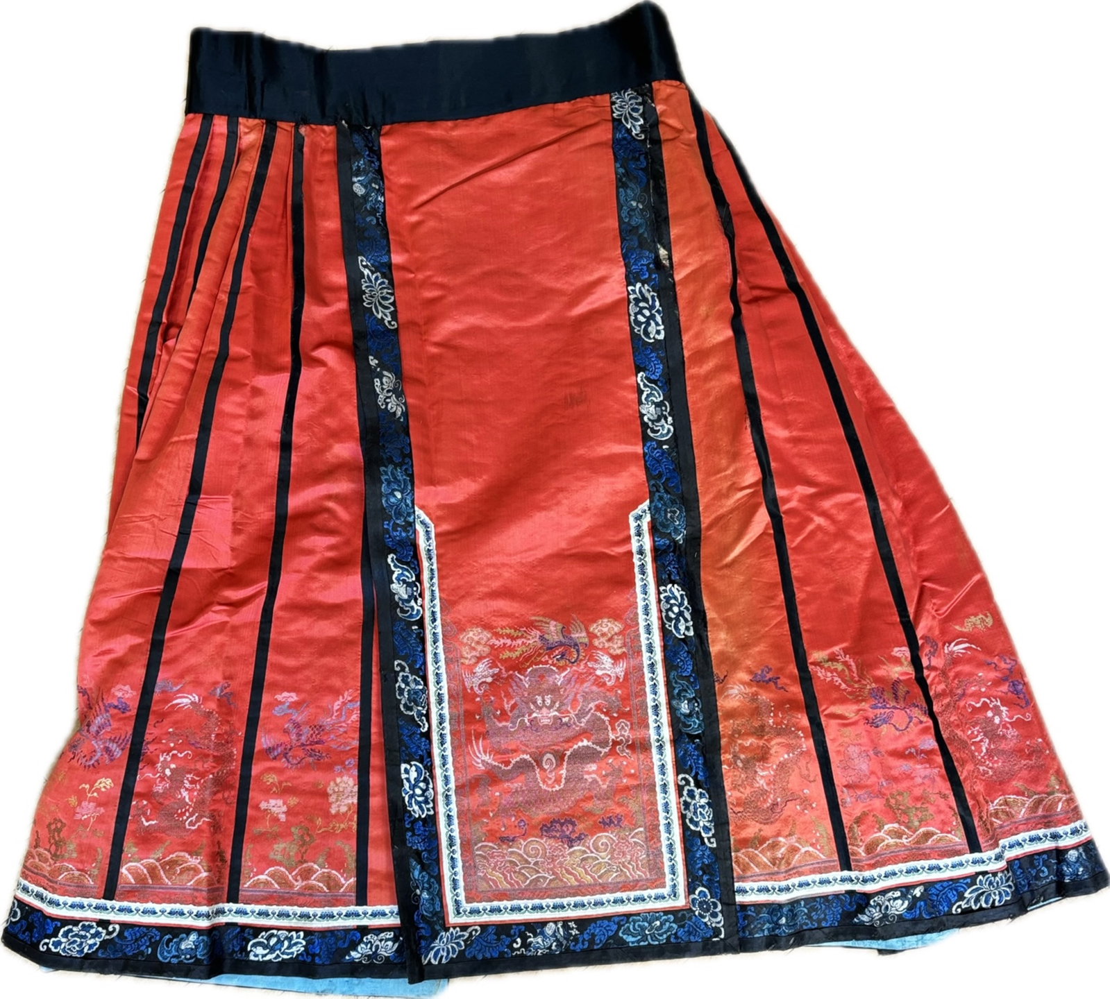 Chinese Apricot Satin Brocade Dragon Phoenix Skirt: Chinese Qing Dynasty Apricot Satin edged with Stencil-Brocade 4-Claw Front Facing Dragon Panels & Profile Dragons & Phoenix to Skirt with ribbons and blue & black embroidery trims. Height of skirt 37 