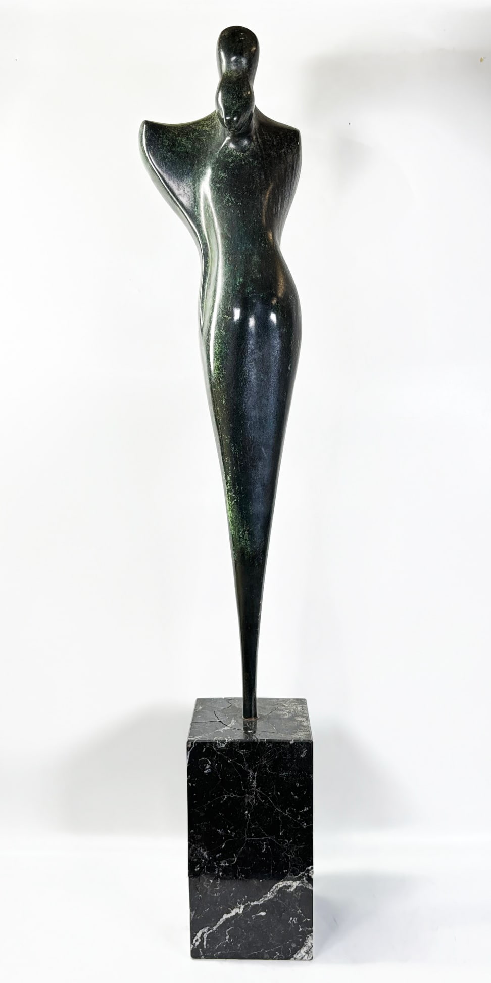 Robert Russin: Bronze Embrace Signed; Marble Stand: Robert Isaiah Russin (NY, 1914- LA, 2007); Bronze Embrace, scratch signed to tapered base of bronze, "RUSSIN 8/8"; with green marble block stand inset with metal socket to top center. Height with base