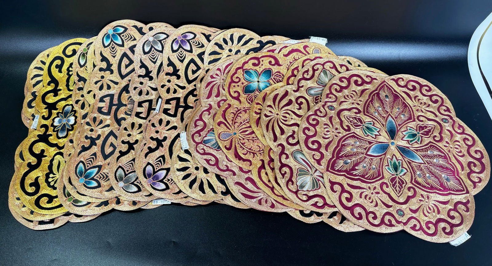 16 Chinese Embroidered and Laid Gold Placemats: 16 Chinese Embroidered and Laid Gold Wrapped thread Placemats, 6 rounds in similar patterns and colors, and 10 square in similar patterns and colors (see images). Approzimate size of Square placemats