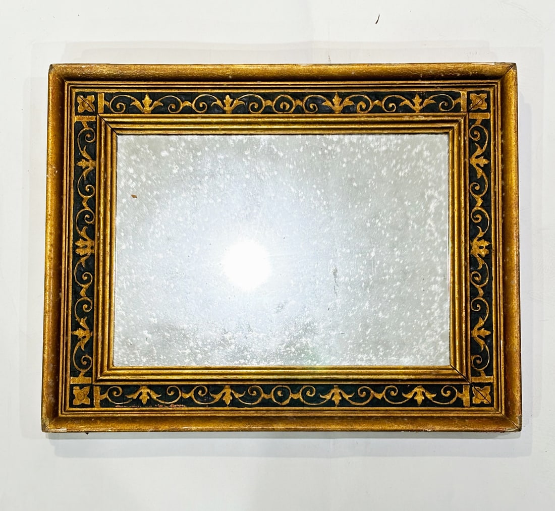 Italian Antique Gilt Black Painted Frame & Mirror: Italian Antique Gilt and Black Painted Frame, the flat with the black paint forming curls and acanthus leaves with 4 point flower corners. now fitted with an "antique" Venetian type spotted mirror. Wi