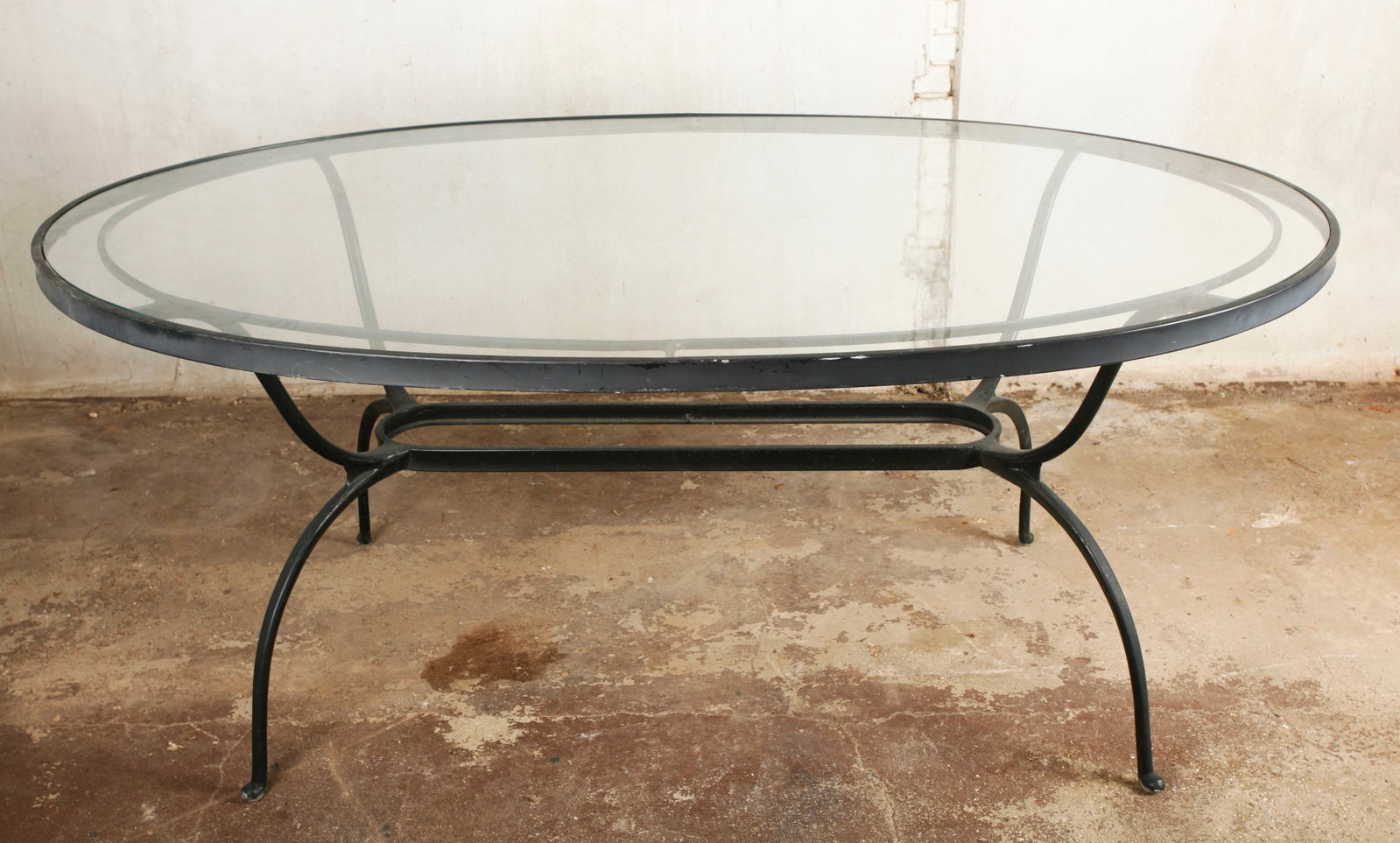 Vintage Oval Glass & Metal Patio Table: Vintage Oval Metal Patio Table on 4 feet with glass top. Height 29 1/2 inches ( 75 cm.) X width 71 1/4 inches (181 cm.). PROVENANCE: Fine furnishings from an Historic 19th Century Lawrence, Long Islan