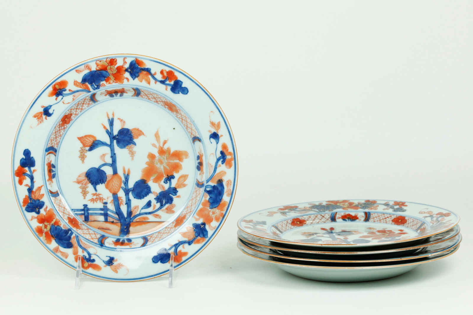 5 Chinese 18C Blue White Iron Red Porcelain Plates: 5 Chinese early 18th Century Blue & White Porcelain Plates with Iron Red and Gilding in a design of the fast-growing, large Paulownia Plant. Diameter 9 inches (22.8 cm.).