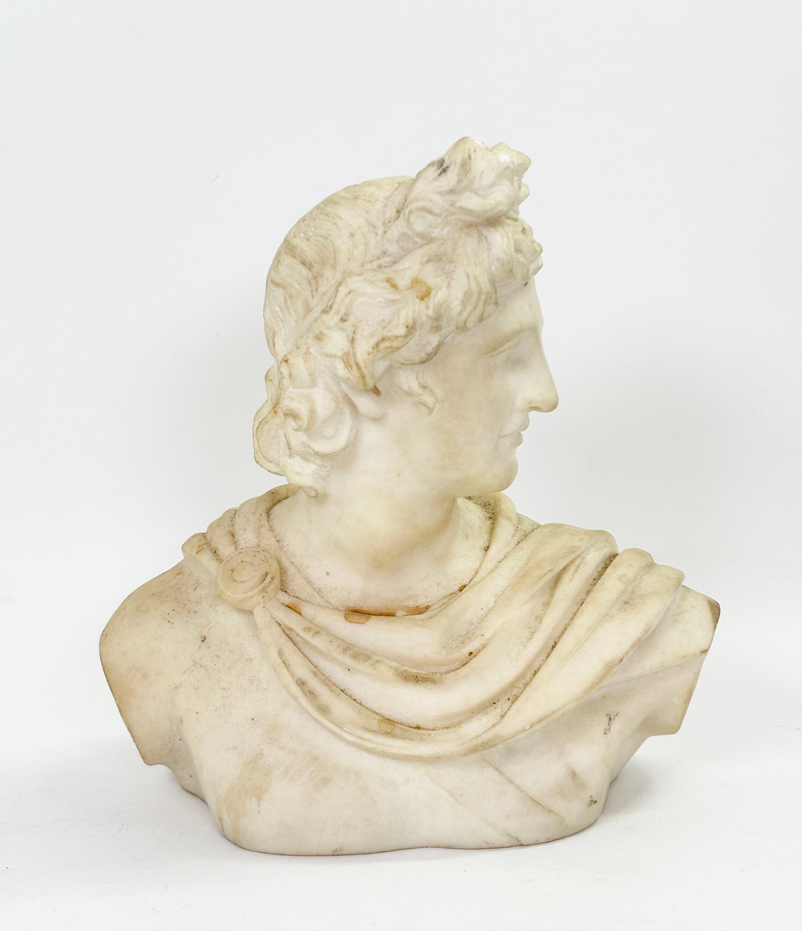 White Marble 19 C Sculpture After Apollo Belvedere: White Marble Italian 19th Century "Grand Tour" Head & Shoulder Sculpture After the full body "Apollo Belvedere" in the Vatican Museum without arms and with chest truncated. Height 9 3/4 inches (24.6 c