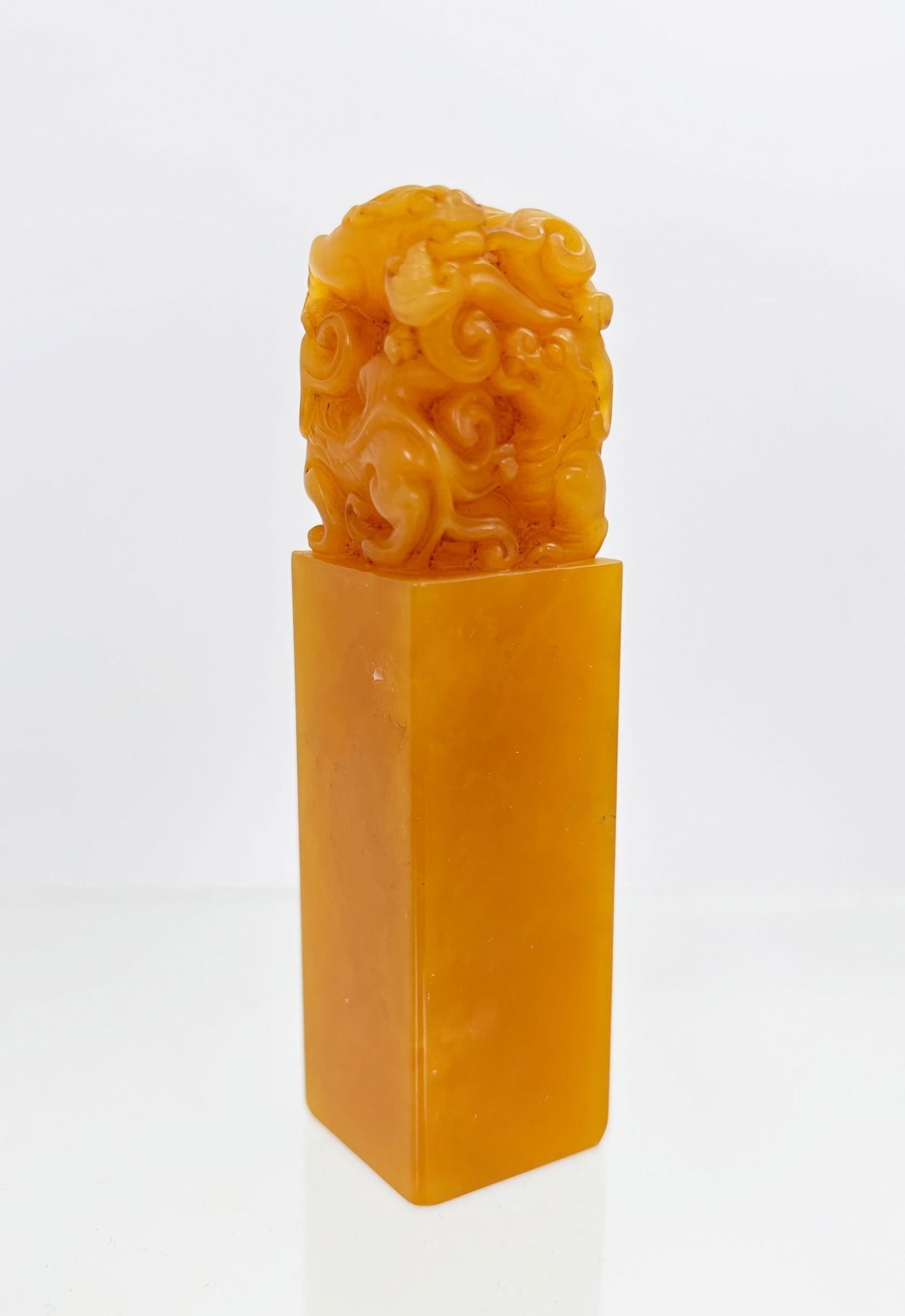 Chinese Yellow Shoushan Soapstone 3 Chilong Seal: Chinese Yellow Shoushan Soapstone Seal with the top well carved with 3 Chilong Dragons, the top holding a Lingzhi in its mouth, a small signature to upper corner of 1 flat side, the bottom uncarved. H