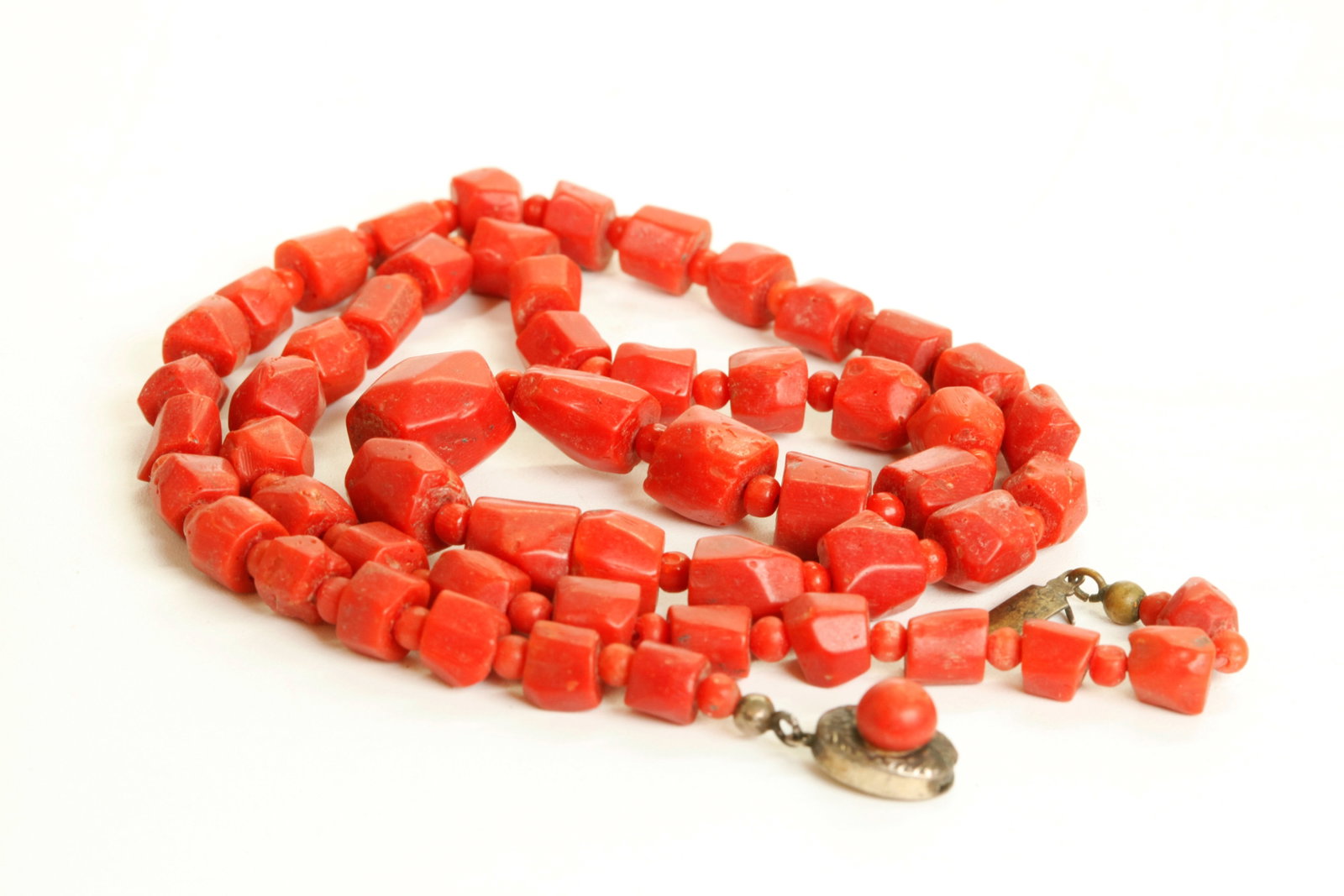Chinese Irregular & Small Dark Coral Bead Necklace: Chinese Irregular Dark Coral Bead Necklace with small round coral spacer beads between, the closure set with a small round bead. Length 24 inches (61 cm.). Total weight 50 grams.