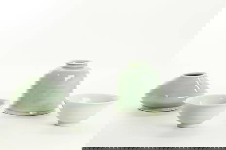 2 Chinese Celadon Porcelain Water Pots; 2 Bowls: 2 Chinese Celadon Porcelain Water Pots, the taller with a flared mouth, the smaller with a broad base and both with wide unglazed foot rings; together with 2 clear glazed tea Bowls with 6 character ma