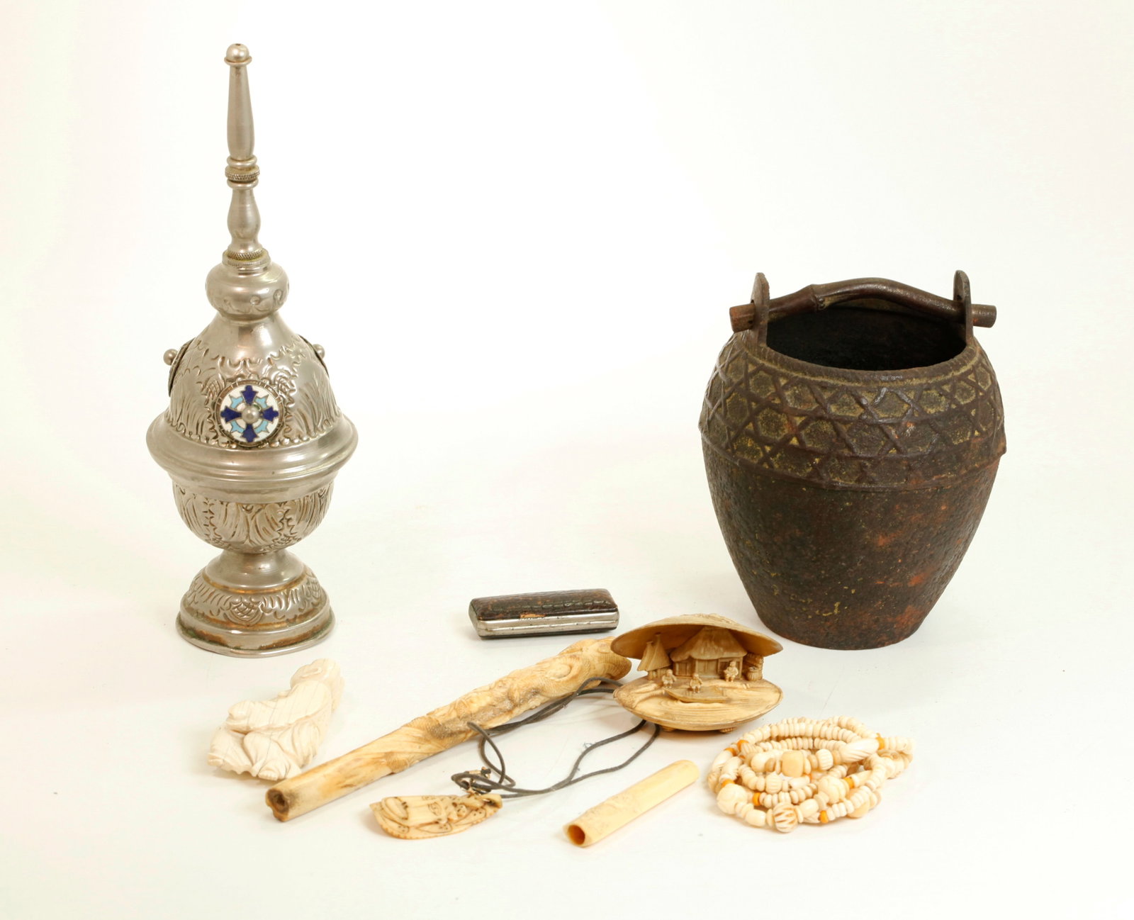 Group of Metal, Bone & Celulose Curios: Group of Metal, Bone & Celulose Curios: a cast iron pot or vase molded with "basket weave" and an imitation bamboo handle in iron; a silvered Water sprinkler (Aspergillum) probably for the Christian M