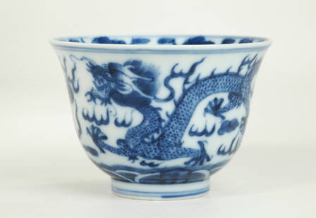 Chinese Blue & White Porcelain Dragon Teacup: Chinese Blue & White Porcelain Cup with a pair of 5-claw Dragons between flaming pearls in clouds over waves, a further Dragon to inside center, the recessed base in clear glaze with a 4 character Tan