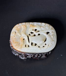 Chinese 19th C Warm White Jade Fish Lotus Plaque: Chinese 19th Century Warm White Jade with touches of russet, well carved, pierced and polished as an oval Plaque with a Fish in Lotus; now wired to hard wood stand carved with vines. Width of jade 3 3