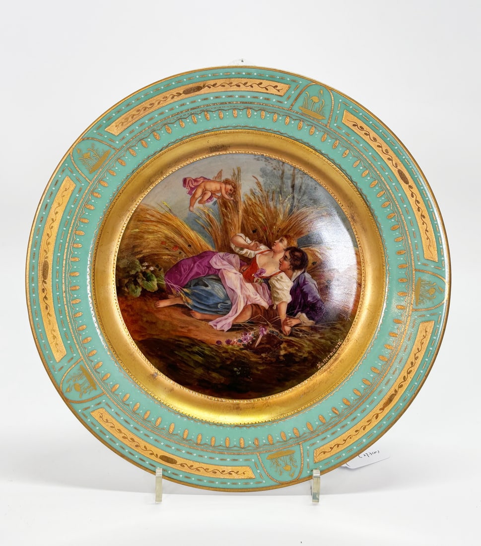 Royal Vienna Austrian Porcelain Plate: Well Painted Royal Vienna Austrian Porcelain Plate with a jade (seafoam) green border detailed with raised and flat gilding and an elaborate center of a Shepherd & Shepherdess with Cherub signed "Latt