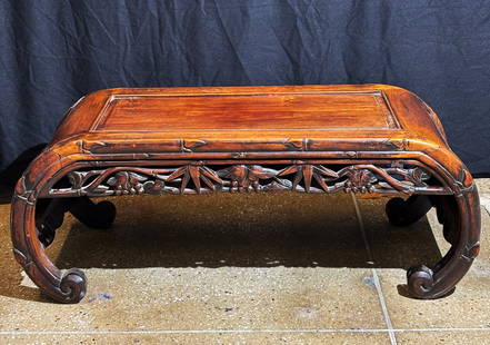Chinese Qing Dynasty Carved Hard Wood Kang Table: Chinese Qing Dynasty Carved Hard Wood Kang Table shaped as a large scroll with curled sides and edges shaped as "bamboo," the solid short sides inlaid with acarved panel of a Rock and Berries on Vines