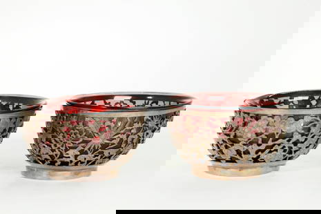 Pr Chinese Qing Peking Glass Bowls Silver Holders: Pair Chinese Qing Dynasty amethyst colored Peking Glass Bowls fitted into pierced and incised Silver Holders with a design of chrysanthemums on stems with leaves, the slightly recessed flat bases with