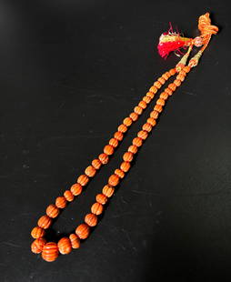54 Asian 18/19 C Fluted Coral Bead Necklace 37.2G: 54 Fine Asian 18th/19th Century well fluted & polished Coral Beads, recently re-strung as a necklace in South East Asia. Total weight 37.2 grams. Length 15 inches (38 cm.).