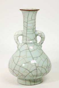 Good Chinese Qing Guanyao Crackle Porcelain Vase: Good Chinese Qing Dynasty Guanyao crackle glazed Porcelain Bottle Vase in pale blue with loop handles to the neck, the tiny bubble suffused glaze with heavy black lines and smaller golden lines, the m