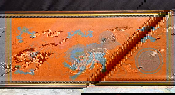 Chinese Silk Embroidered Felt Panel; Framed: Chinese Silk Embroidered Horizontal Orange Felt Panel with a Mythological Beast surrounded by Bats and Auspicious Objects with a large Ball and with laid gold wrapped thread forming ribbons across the