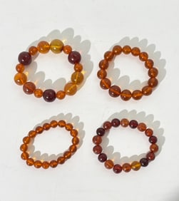 4 Chinese Amber Round Bead Bracelets; 765G