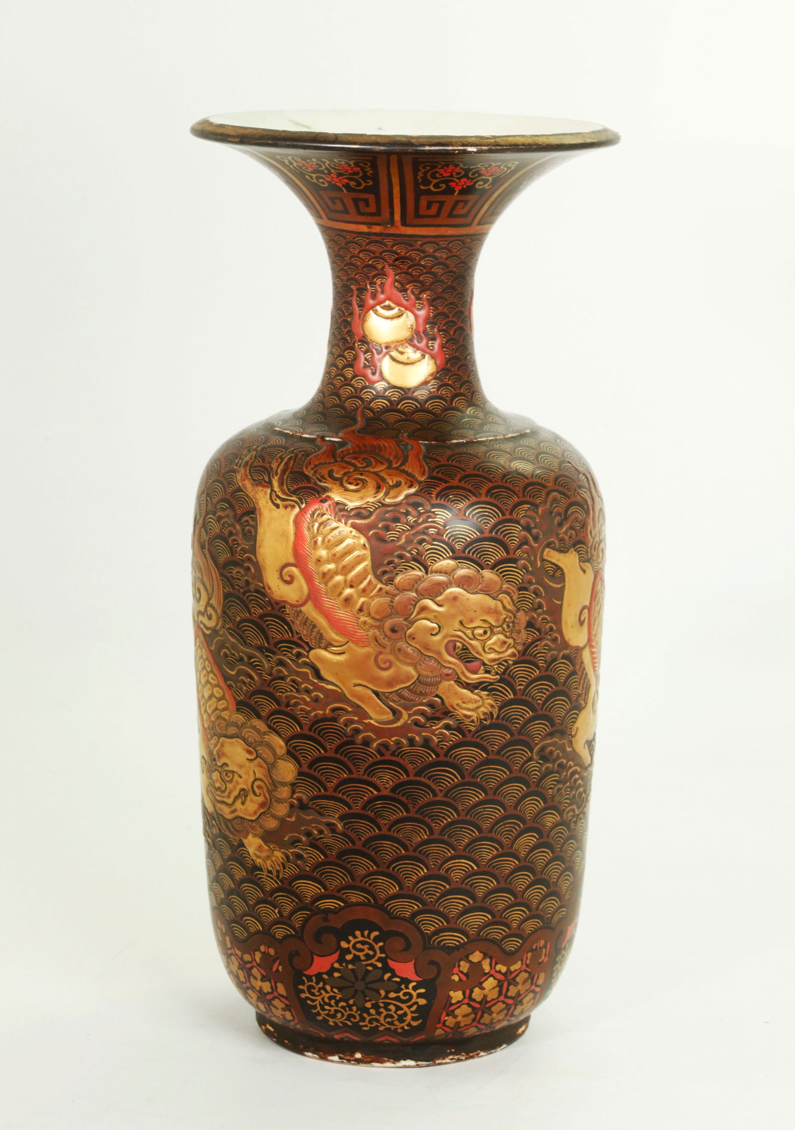 Japanese Black Red & Gold Lacquered Porcelain Vase: Japanese 19th Century Black, Red & Gold Lacquered Porcelain Vase with a raised lacquer design of 4 Shishi Dogs on Water around sides, the neck with raised Flaming Pearls on Water ; the inside and base