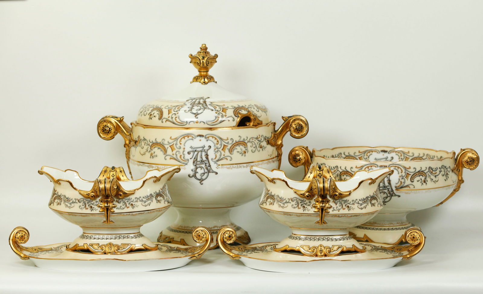 4 Jean Pouyat Limoges 1880 Centerpiece Porcelains: 4 Jean Pouyat Limoges circa 1880 Centerpiece Porcelains to be used separately or together: the largest an elaborately handled Tureen with Cover with gap for silver ladle and Gold Urn Finial, an elabor