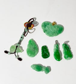 7 Chinese Pale to Dark Green Jadeite Pendants