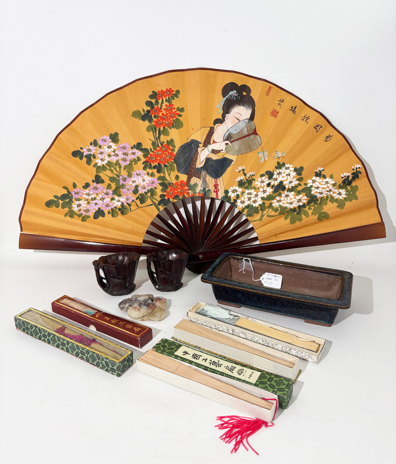 10 Chinese Curios; Pr Cups Lingzhi Planter 6 Fans: 10 Chinese Curios; a Pair of carved light-wood "Lotus" Cups with lotus stems forming a handle on each, a shoushan soapstone Lingzhi paperweight, a glazed rectangular Planter with 2 original holes for