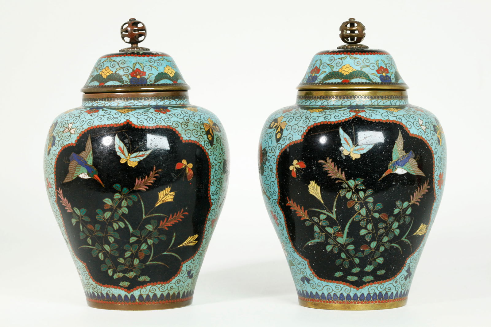 Pr Japanese Meiji Enameled Bronze & Turquoise Jars: Pair Japanese Meiji Period (1868-1912) jars & covers with bronze swivel finials, the fronts with windows of Kingfisher birds, flowers and butterflies on a black ground with a similar window to the bac
