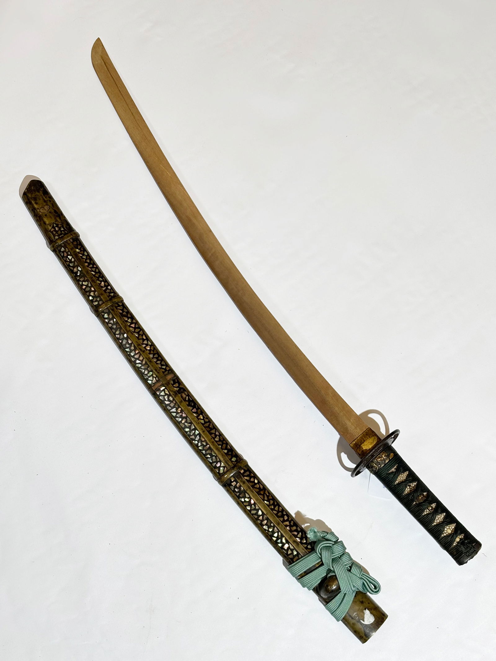 Japanese Samurai Handle & Sheath; Tsuba Etc: Japanese Sword Scabbard with inlaid shell, the handle with menuki, kashira, fuchi and an early iron tsuba; with a wood substitute blade. Total length 29 3/4 inches. Collection: Collector's early purch