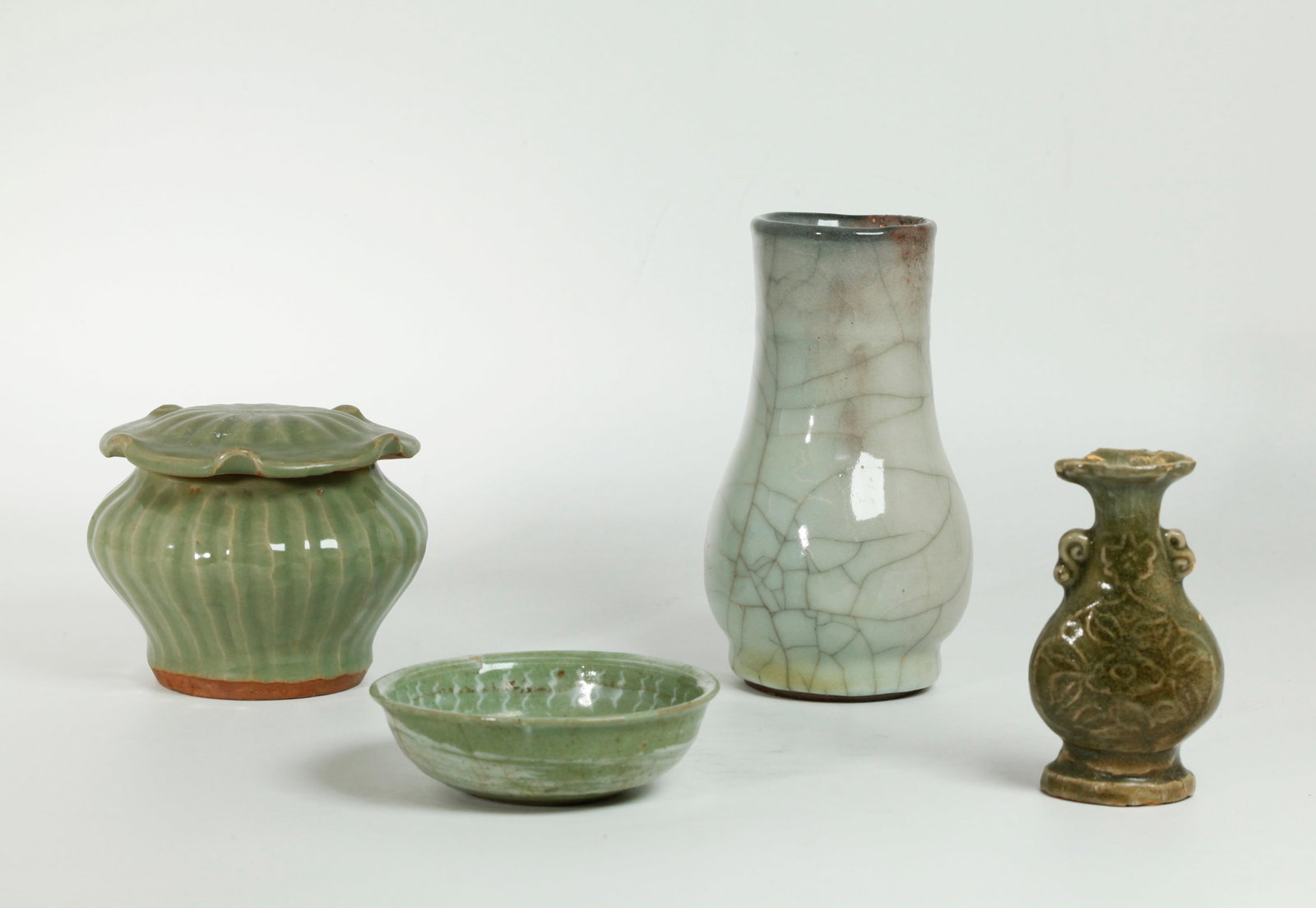 3 Chinese Celadon Porcelains; Japanese Mishima: 3 Good Chinese Celadon Porcelains a guanyao crackle vase with a thick pale bubble-suffused celadon glaze with the unglazed foot ring in a dark brown slip, a Lotus Jar with ribbed sides and a Lotus Lea