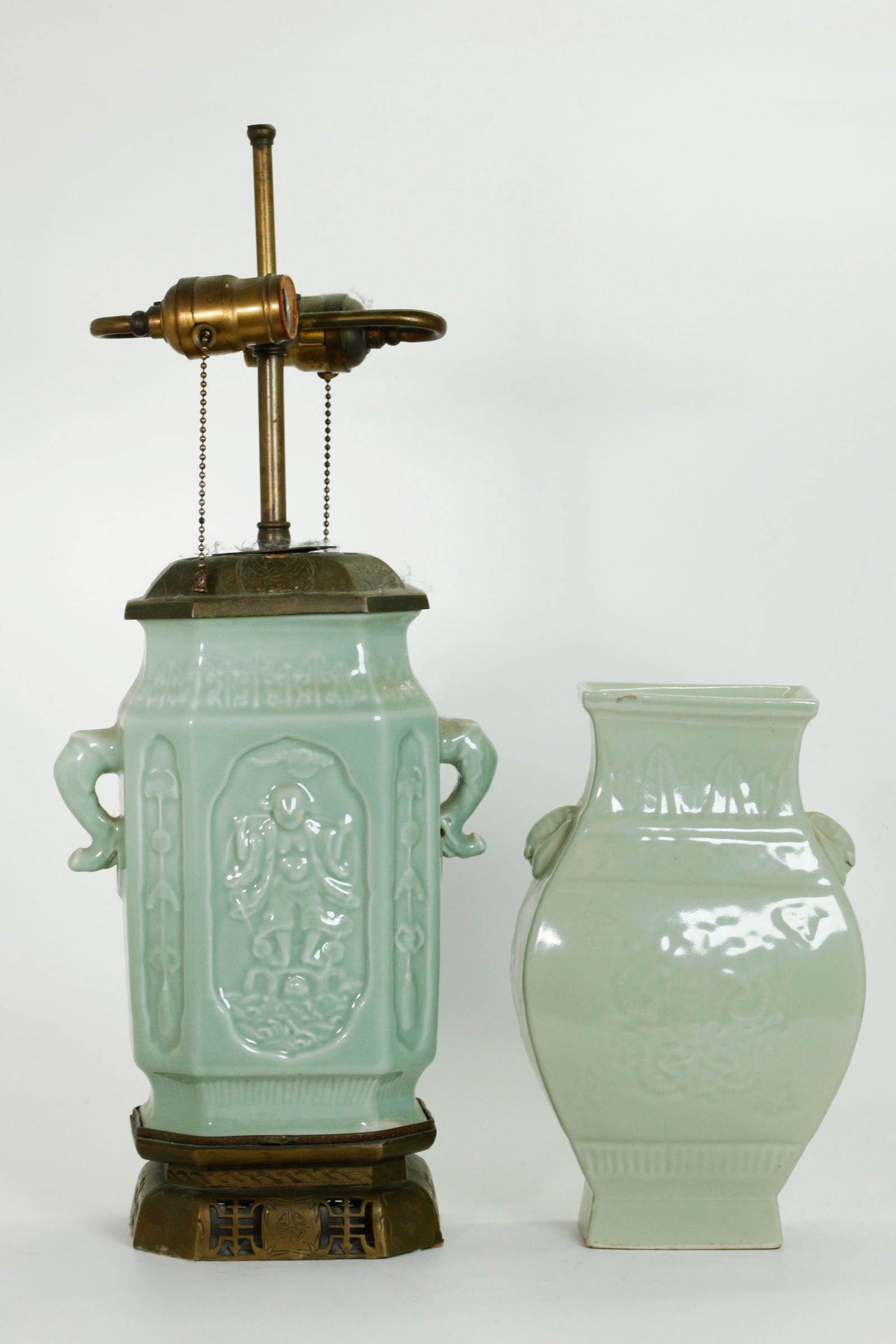 2 Chinese Pale Celadon Molded Paneled Vases: 2 Chinese Pale Celadon Paneled Vases; the larger with elephant & ring handles and a molded image of Liu Hai feeding Money to his Toad to both sides; mounted with old Chinese engraved and pierced bronz