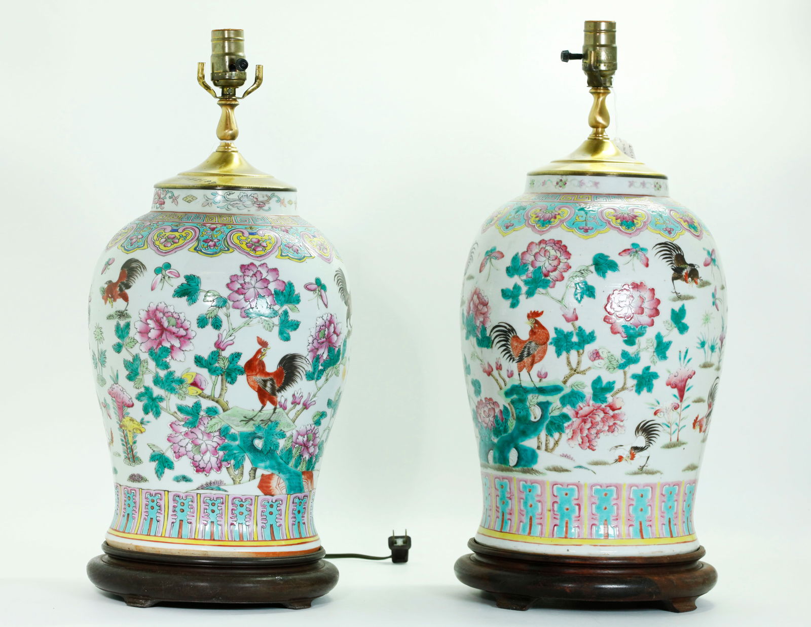 Pr Lg Chinese Famille Rose Porcelain Jar Lamps: Pair Large Chinese Famille Rose enameled Porcelain Jars with chickens, butterflies and flower sprigs to the clear glazed body, a ruyi cloud collar to the shoulders and leaves around base in turquoise,