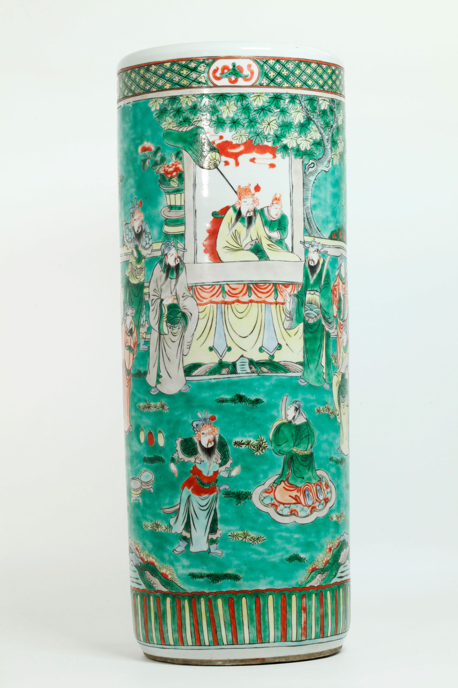 Chinese Famille Verte Porcelain Umbrella Stand: Large 19th Century Chinese Famille Verte Porcelain Umbrella Stand with a design of Officials and Generals at a Garden Tribunal, with Butterflies in the sky, the design between brocade bands; the base